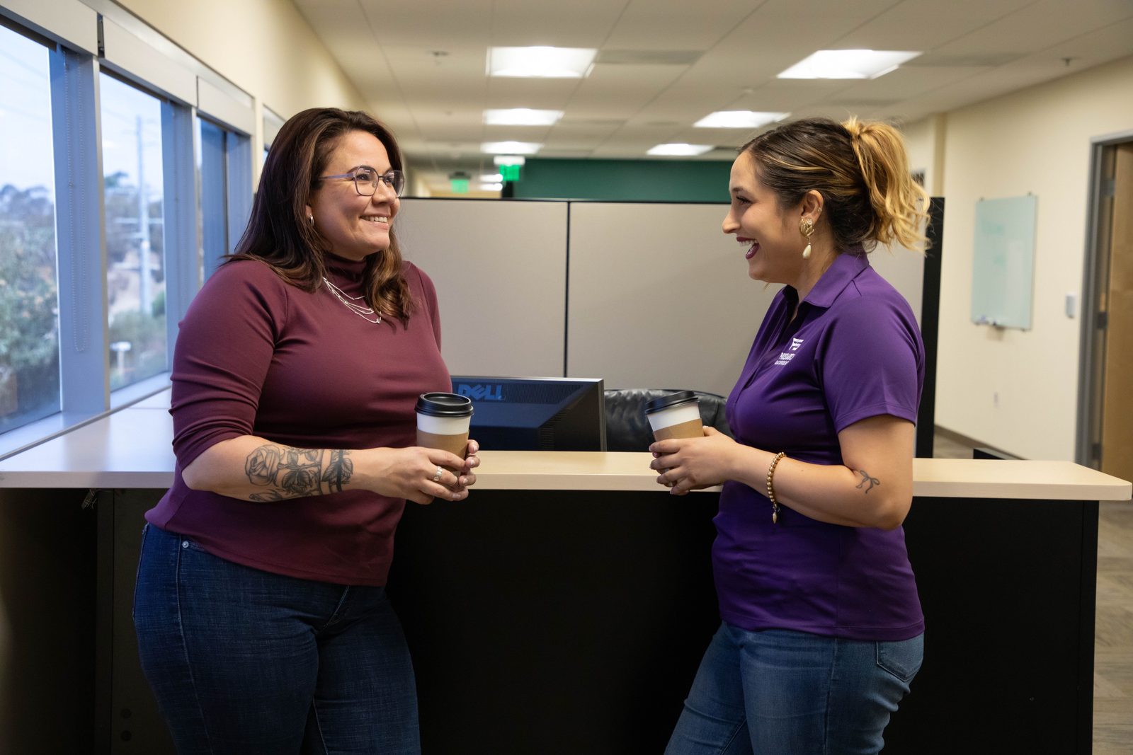 Two PSBI team members talking together