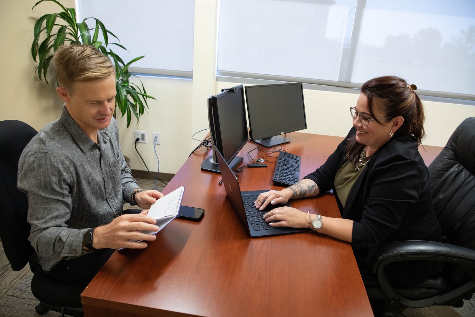 PSBI coworkers collaborating at a desk